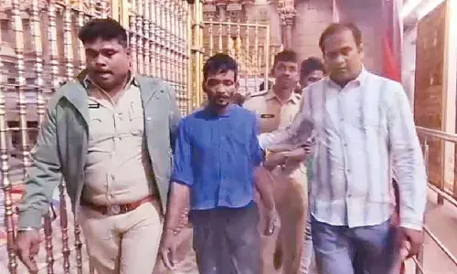 Intoxicated man scales Gopuram at Govindaraja Swamy temple Intoxicated man scales Gopuram at Govindaraja Swamy temple