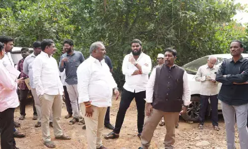 Officials check potential lands for development Officials check potential lands for development