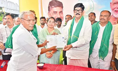 Anam distributes new pattadar passbooks Anam distributes new pattadar passbooks