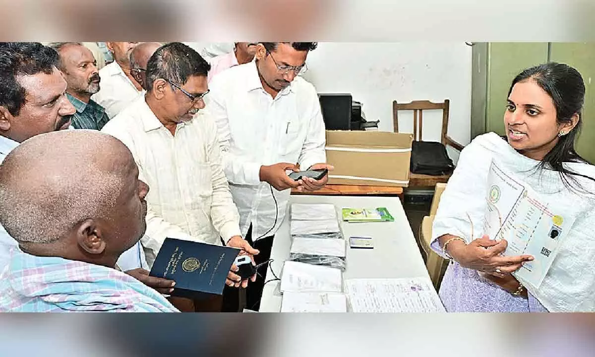 Collector distributes new pattadar passbooks Collector distributes new pattadar passbooks