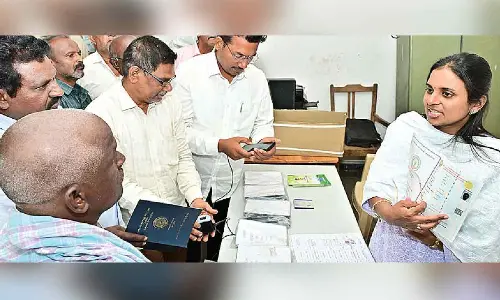 Collector distributes new pattadar passbooks Collector distributes new pattadar passbooks