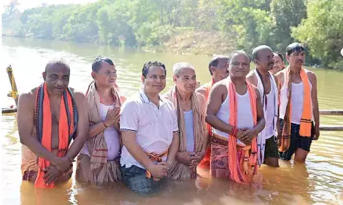 Majhi takes holy dip in Baitarani river Majhi takes holy dip in Baitarani river