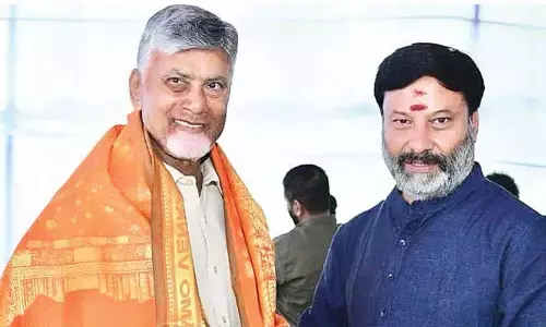 TTD board member presents Gita to CM