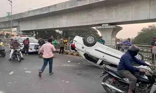 Car overturns on Begumpet flyover, four injured