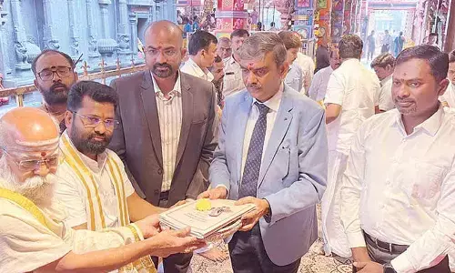 Budget copies placed before Goddess Durga before presentation