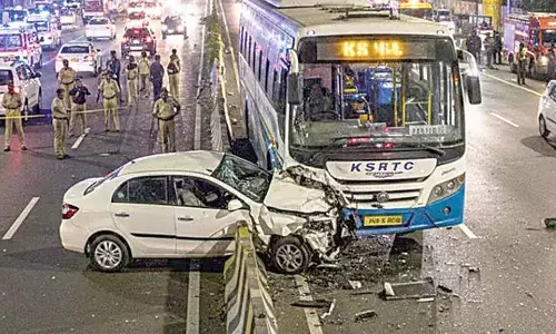 Speeding car jumps divider and crashes into KSRTC bus