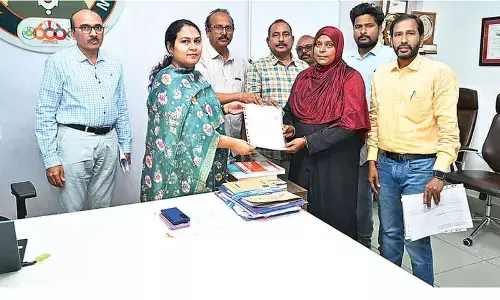 Commissioner distributes allotment letters under PMAY 2.0