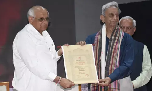 Gujarat CM felicitates writers, urges preservation of mother tongue Gujarat CM felicitates writers, urges preservation of mother tongue