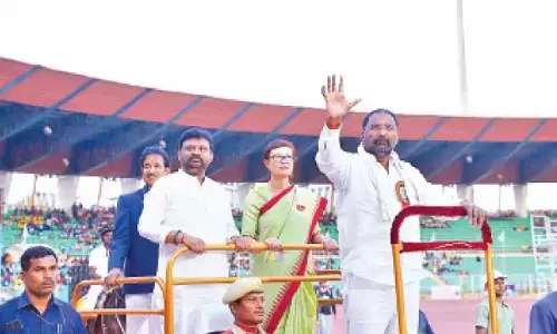 Sports Minister Vakiti Srihari waves to the gathering after inaugurating the State-Level Finals of the 2nd Edition of the Chief Minister’s Cup 2025 at Gachibowli Stadium on Friday