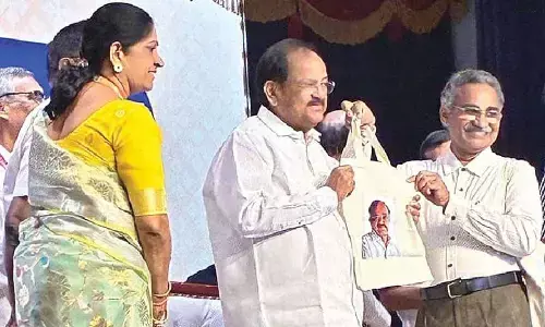Cloth bag presented to Venkaiah to promote plastic-free living