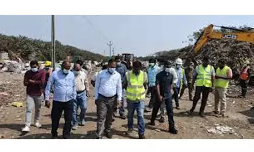 Malkajgiri sanitation workers told to remove garbage heaps