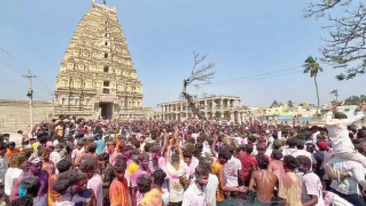 Foreign tourists join thousands in vibrant Holi celebrations at Hampi Foreign tourists join thousands in vibrant Holi celebrations at Hampi