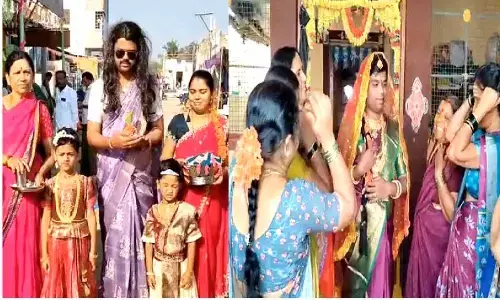 Saree clad men offer prayers in Adoni