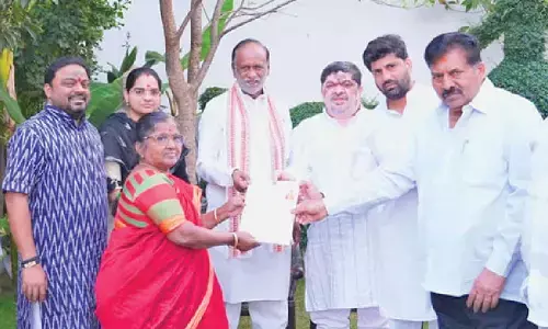 Pattas for 2BHK houses handed over to Dalit slum dwellers