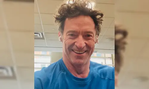 Hugh Jackman brings out his music side for Rupert Murdoch