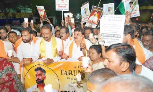 BJP chief joins candlelight march demanding justice for Tarun Kathik