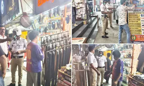 Madivala traffic police clear encroached footpath