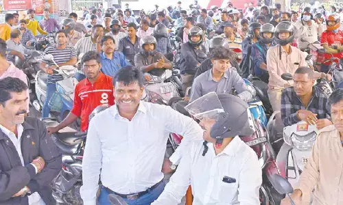 People’s rush for fuel at a petrol bunk in Hyderabad