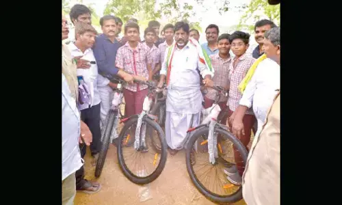 Bhatti distributes bicycles to schoolchildren