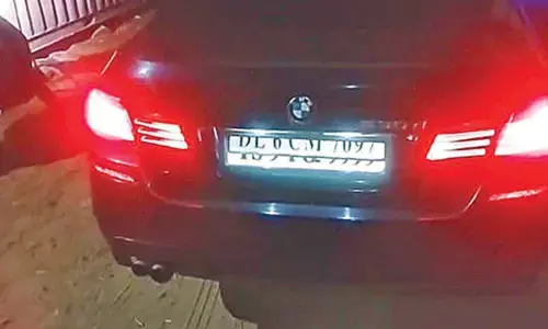 BMW driver installs high-tech system to swap number plates