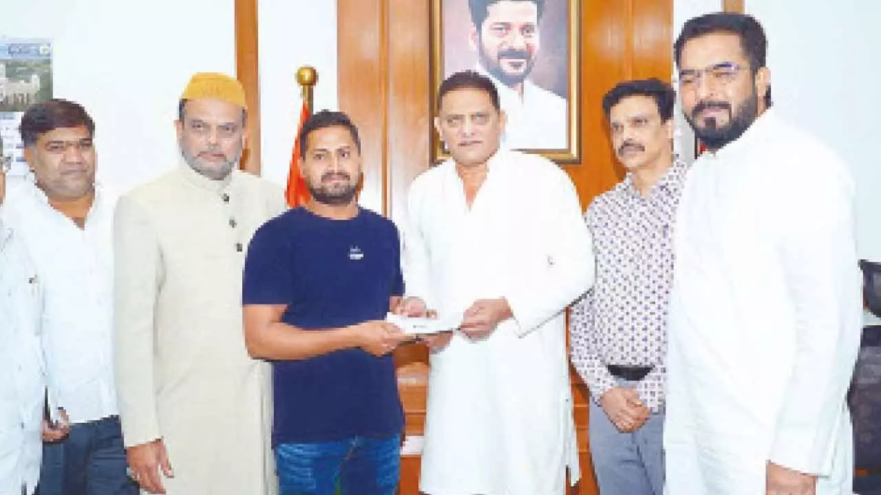 Minority Welfare Minister Mohammed Azharuddin, AIMIM MLA Mohammed Majid Hussain and State Haj Committee Chairman Khusro Pasha distribute ex-gratia cheques to the families of victims who lost their lives in the Madina bus tragedy in Saudi Arabia, at the Secretariat in Hyderabad on Wednesday Minority Welfare Minister Mohammed Azharuddin, AIMIM MLA Mohammed Majid Hussain and State Haj Committee Chairman Khusro Pasha distribute ex-gratia cheques to the families of victims who lost their lives in the Madina bus tragedy in Saudi Arabia, at the Secretariat in Hyderabad on Wednesday