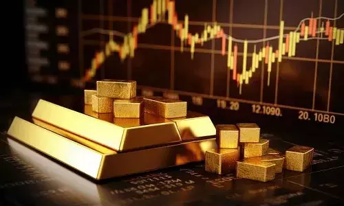 Gold futures rise on spot demand