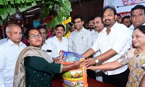 Collector Dr S Venkateswar and MLA Arani Srinivasulu launching the subsidised BPT rice distribution center for ration cardholders at the Tirupati Rythu Bazaar on Monday