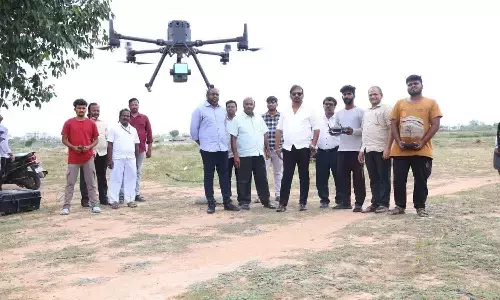 TUDA Chairman Dr C Divakar Reddy, Secretary Dr NV Sreekanth Babu, and engineers inspecting the drone survey operations for Settipalli Model Township in Tirupati on Monday