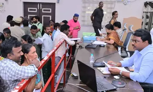 Collector P Raja Babu receiving petitions from public at the PGRS programme in Ongole on Monday