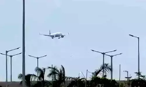 First Commercial Flight Lands At Bhogapuram Airport, Passengers Welcomed With Etikoppaka Toys