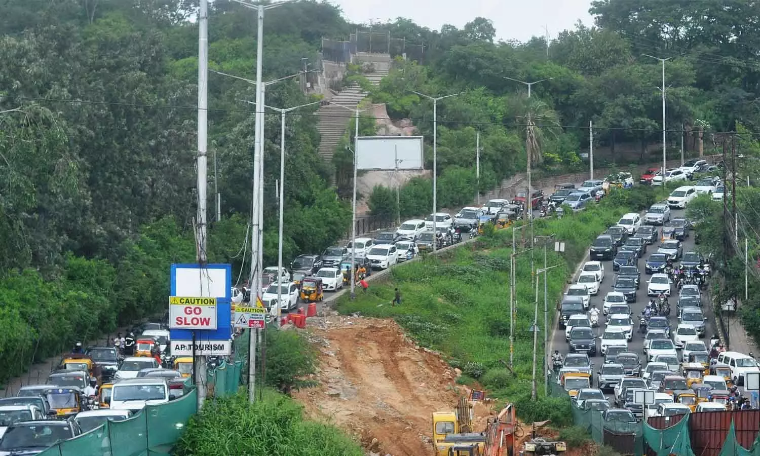 Vehicles move at a snail’s pace due to huge traffic following traffic diversion around KBR Park in Hyderabad on Tuesday. Photo: Ch Prabhu Das Vehicles move at a snail’s pace due to huge traffic following traffic diversion around KBR Park in Hyderabad on Tuesday. Photo: Ch Prabhu Das