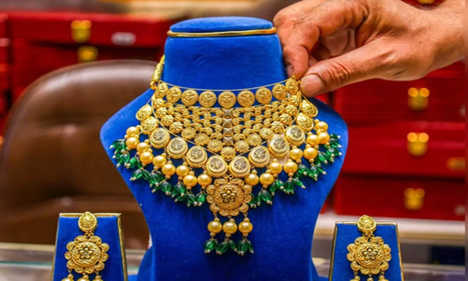 Gold prices drop marginally as investors await US Fed Chair remarks