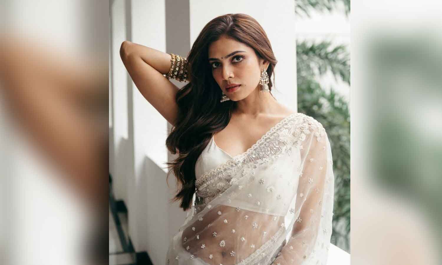 Malavika Mohanan Stuns in Elegant All-White Saree Look