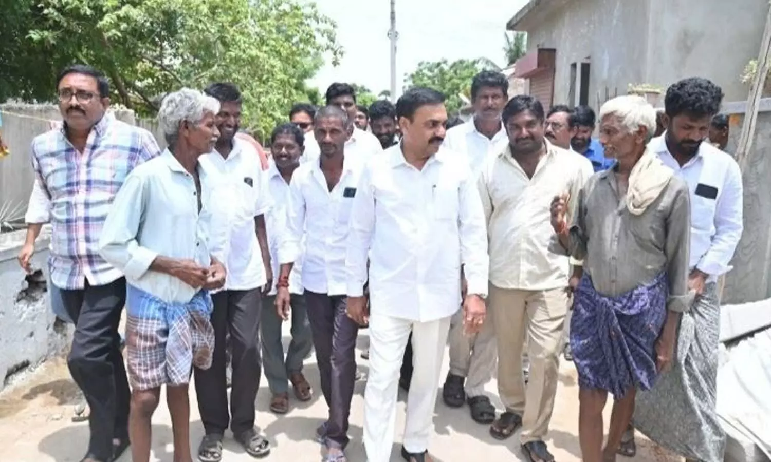 YSRCP leader Kakani Govardhan Reddy interacting with farmers in Dammayapalem village on Friday YSRCP leader Kakani Govardhan Reddy interacting with farmers in Dammayapalem village on Friday