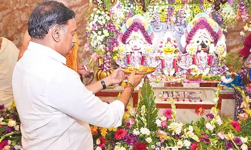 Vijayawada MP Kesineni Sivanath (Chinni) and senior TDP leader Bopanna Bhavakumar offering prayers during Sri Krishna Janmashtami celebrations at the ISKCON Temple in Ramalingeswara Nagar on Friday