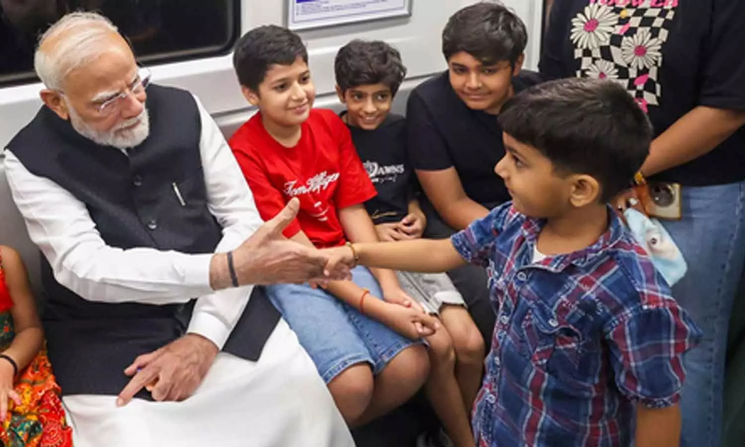 PM Modi attends SRCC centenary celebrations, travels by Metro and releases commemorative coin PM Modi attends SRCC centenary celebrations, travels by Metro and releases commemorative coin