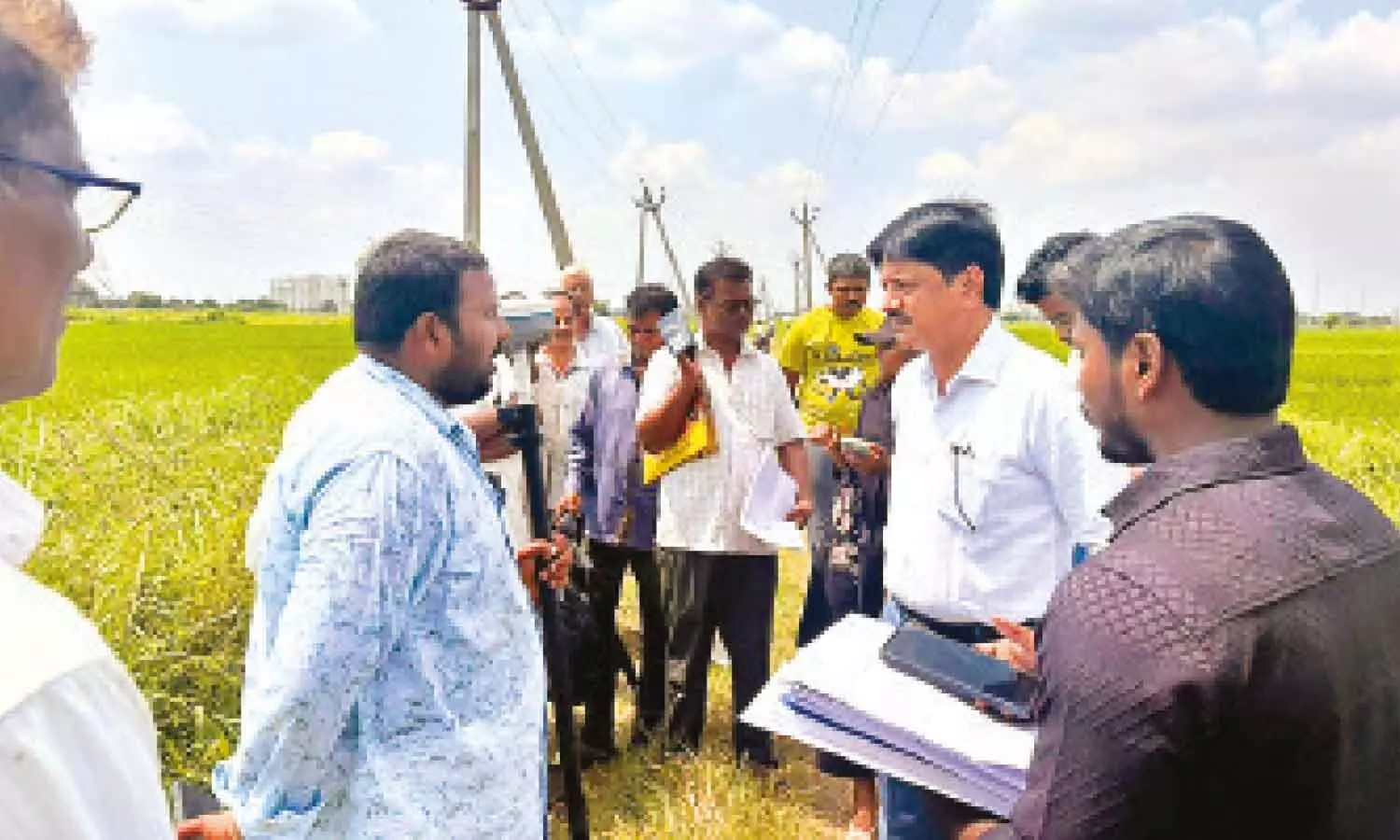 State director of survey, settlement and land records Ronanki Kurmanadh interacts with farmers during his surprise inspection of the re-survey at Guntupalli in Ibrahimpatnam mandal of NTR district on Saturday State director of survey, settlement and land records Ronanki Kurmanadh interacts with farmers during his surprise inspection of the re-survey at Guntupalli in Ibrahimpatnam mandal of NTR district on Saturday