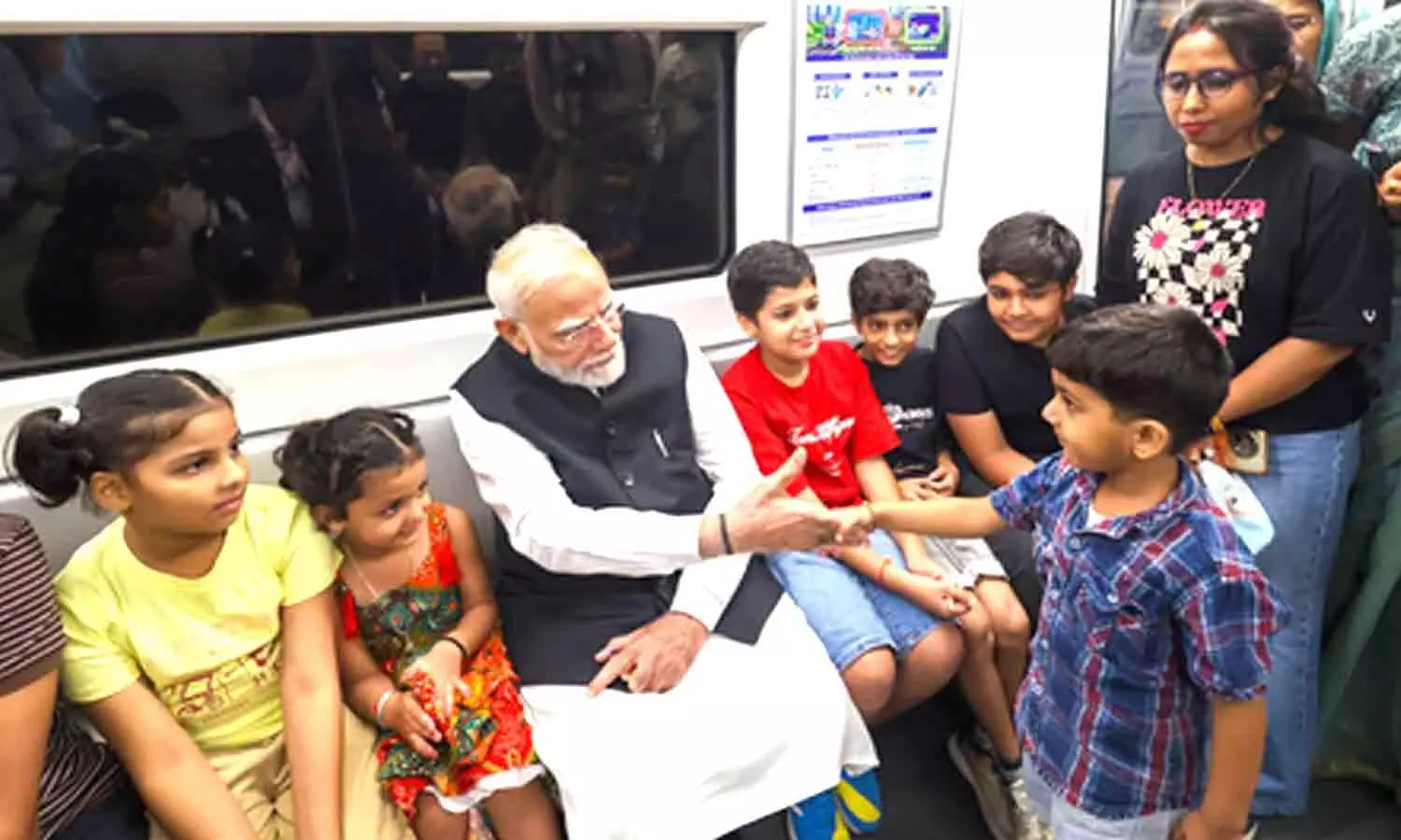 I want to become like you: Boy whispers into PM Modis ear during Delhi Metro ride I want to become like you: Boy whispers into PM Modis ear during Delhi Metro ride