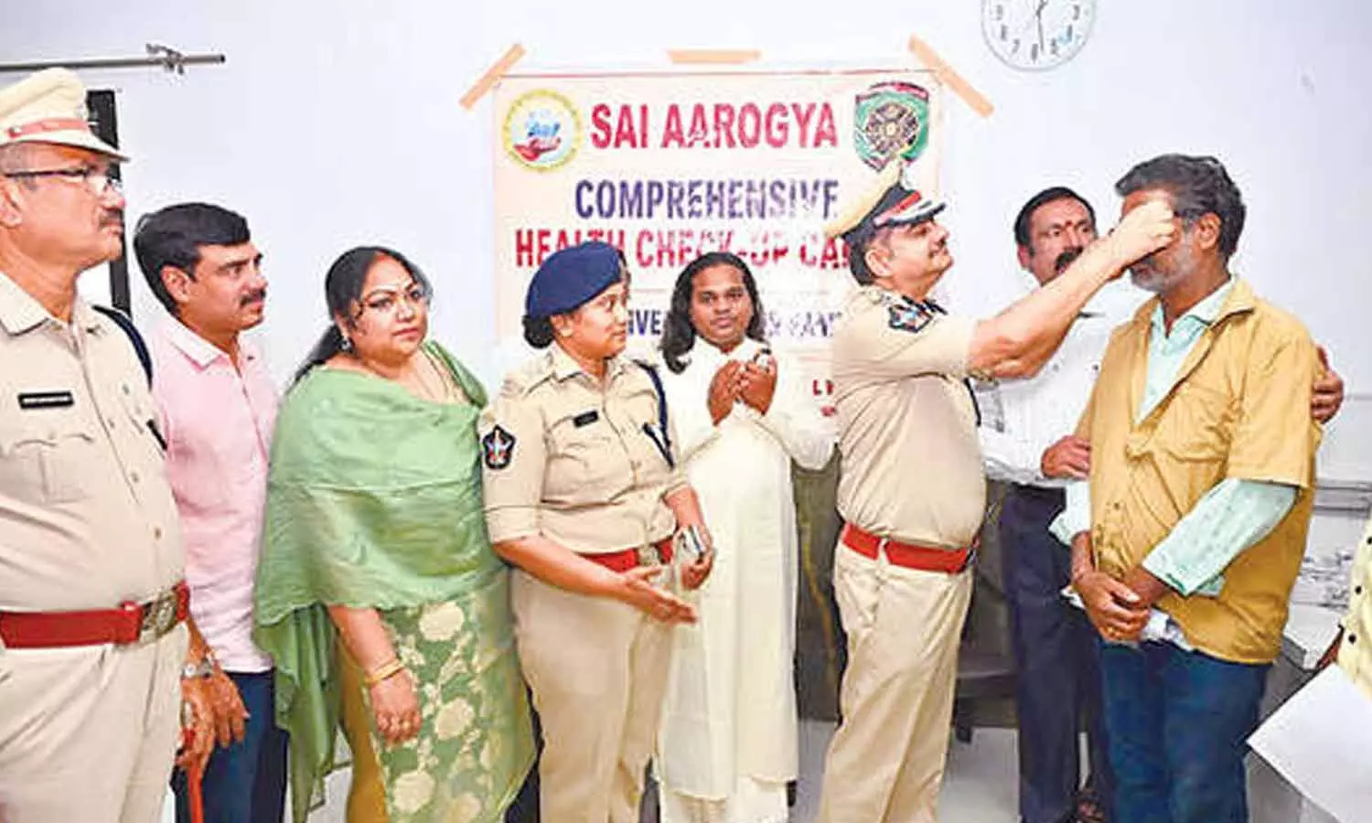 City Commissioner of Police Shankhabrata Bagchi offering a pair of spectacles to an auto-rickshaw driver at the medical camp organised in Visakhapatnam on Sunday. City Commissioner of Police Shankhabrata Bagchi offering a pair of spectacles to an auto-rickshaw driver at the medical camp organised in Visakhapatnam on Sunday.