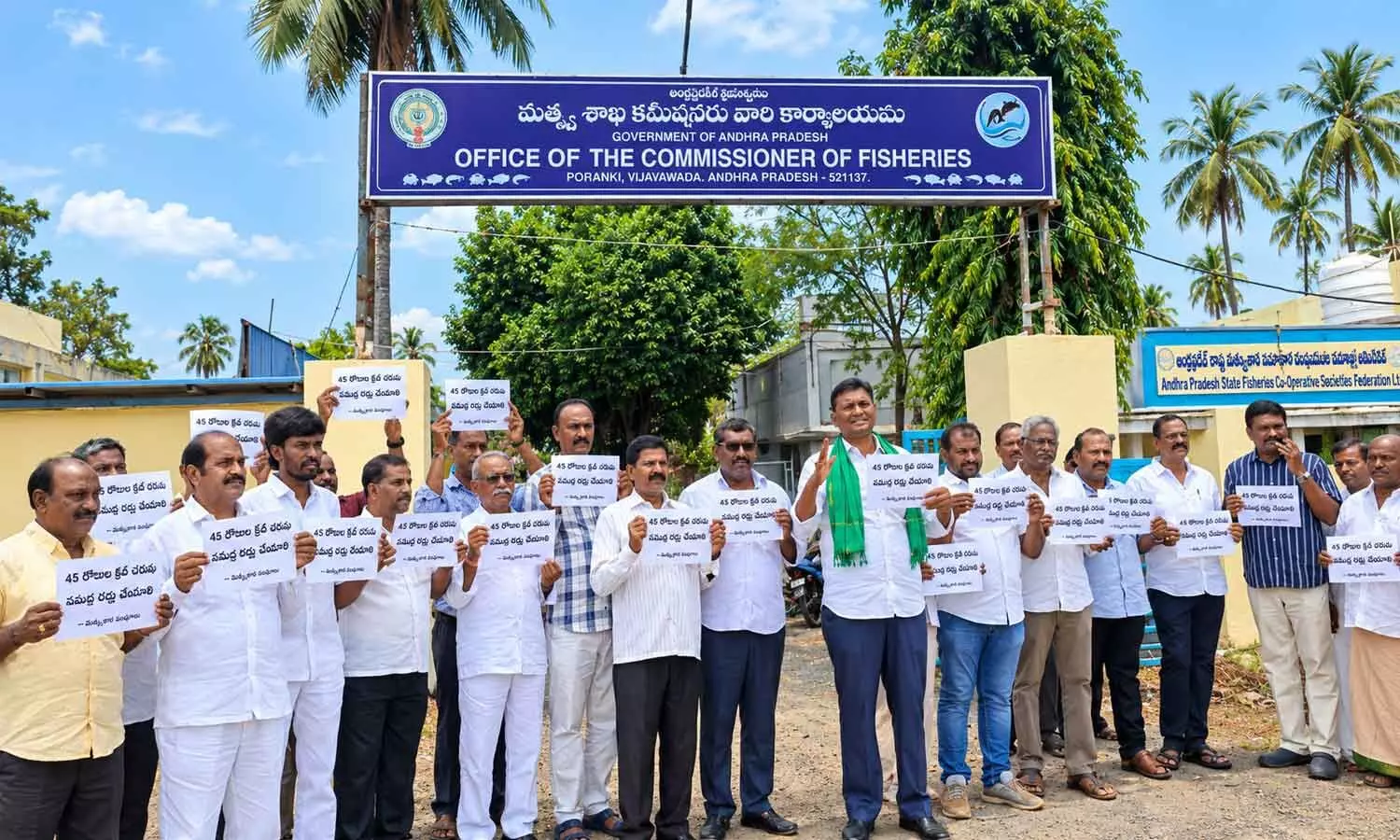 Prawn Farmers Association leaders staging a protest in front of the office of Commissioner of Fisheries in Vijayawada on Monday Prawn Farmers Association leaders staging a protest in front of the office of Commissioner of Fisheries in Vijayawada on Monday