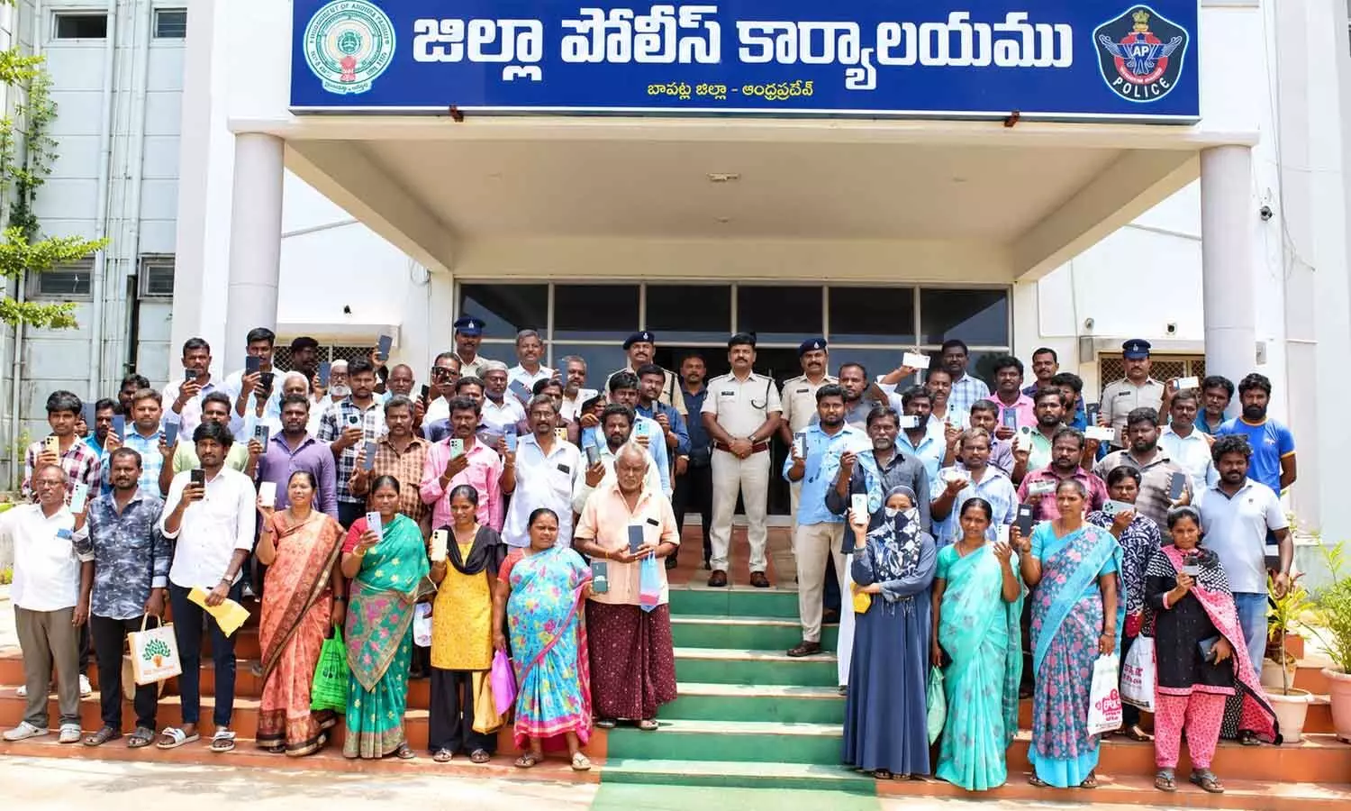 SP B Umamaheswar with a group of owners, who received their lost mobile phones, in Bapatla on Monday SP B Umamaheswar with a group of owners, who received their lost mobile phones, in Bapatla on Monday