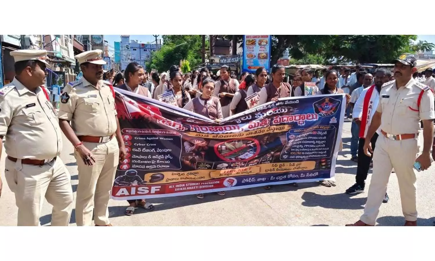 SDPO Narasimha Murthy leading college students during a police awareness rally against drugs, cyber crimes, and offences against women in Srikalahasti on Monday SDPO Narasimha Murthy leading college students during a police awareness rally against drugs, cyber crimes, and offences against women in Srikalahasti on Monday