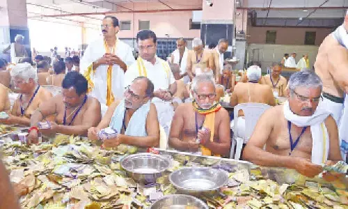 Sri Durga Malleswara Swamy Varla Devasthanam EO VK Seena Naik supervising the counting of hundi collections at the Mallikarjuna Maha Mandapam atop Indrakeeladri in Vijayawada on Wednesday