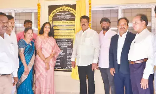 MLA Bonda Umamaheswara Rao unveiling the plaque of the newly constructed library building at SRR College in Vijayawada on Wednesday