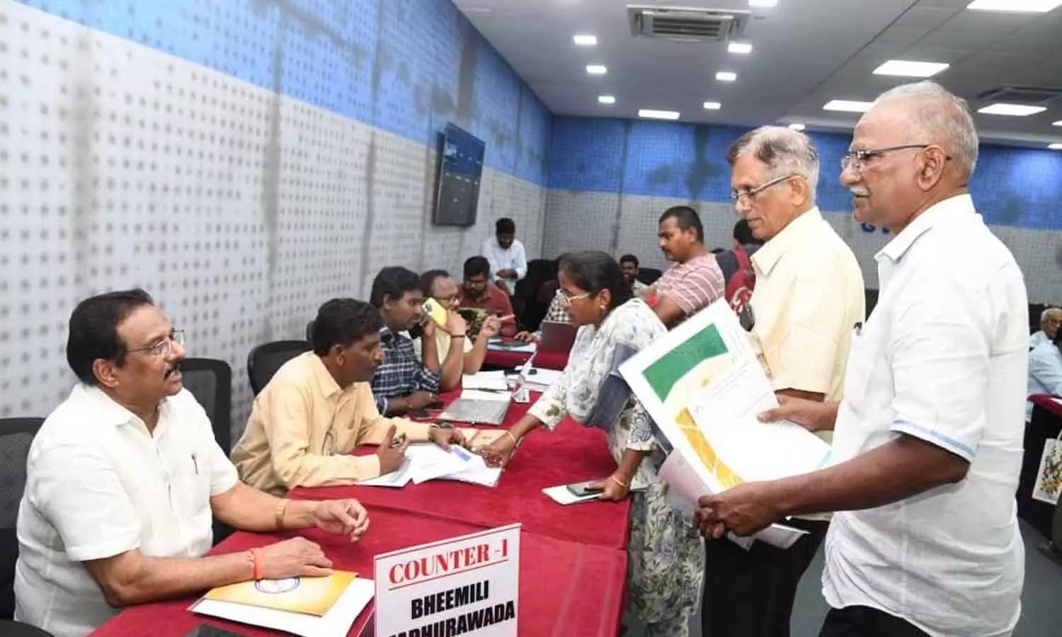 People approaching officials at the special town planning open forum organised at the GVMC main office in Visakhapatnam on Thursday People approaching officials at the special town planning open forum organised at the GVMC main office in Visakhapatnam on Thursday