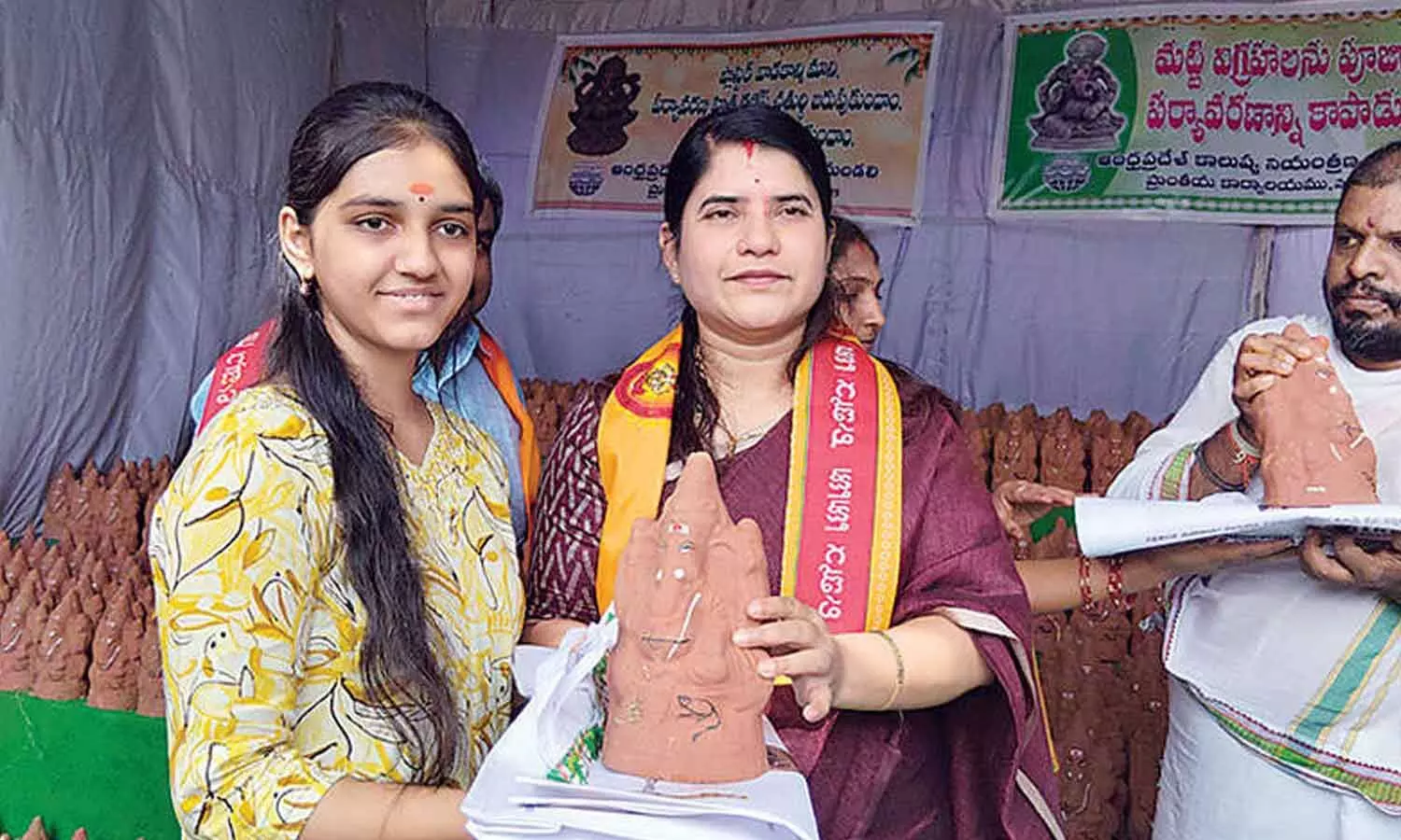 Collector Rajakumari during the distribution of clay Ganesha idols in Nandyal on Sunday Collector Rajakumari during the distribution of clay Ganesha idols in Nandyal on Sunday