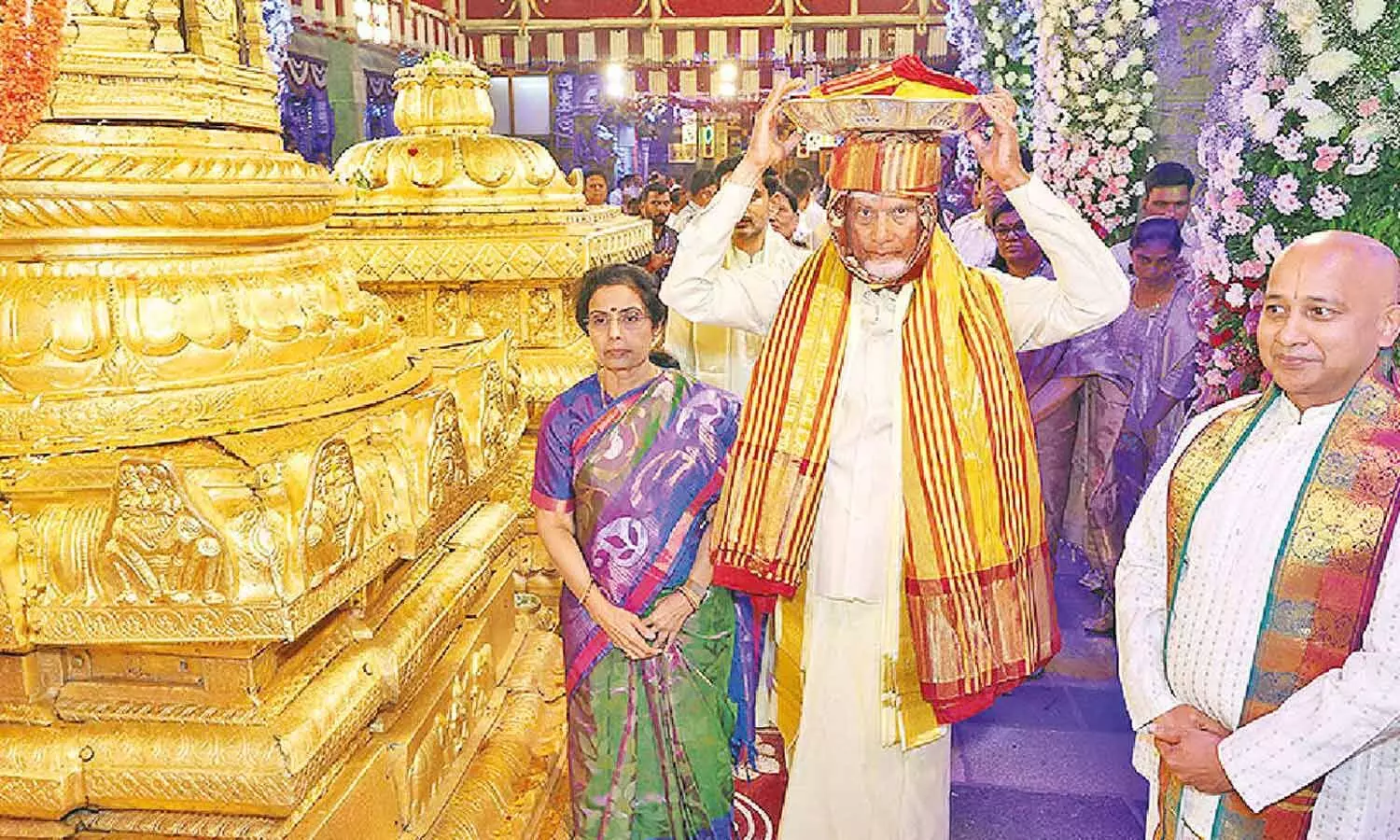 Chief Minister N Chandrababu Naidu carrying silk robes on his head with his wife to Srivari temple in Tirumala on Tuesday Chief Minister N Chandrababu Naidu carrying silk robes on his head with his wife to Srivari temple in Tirumala on Tuesday