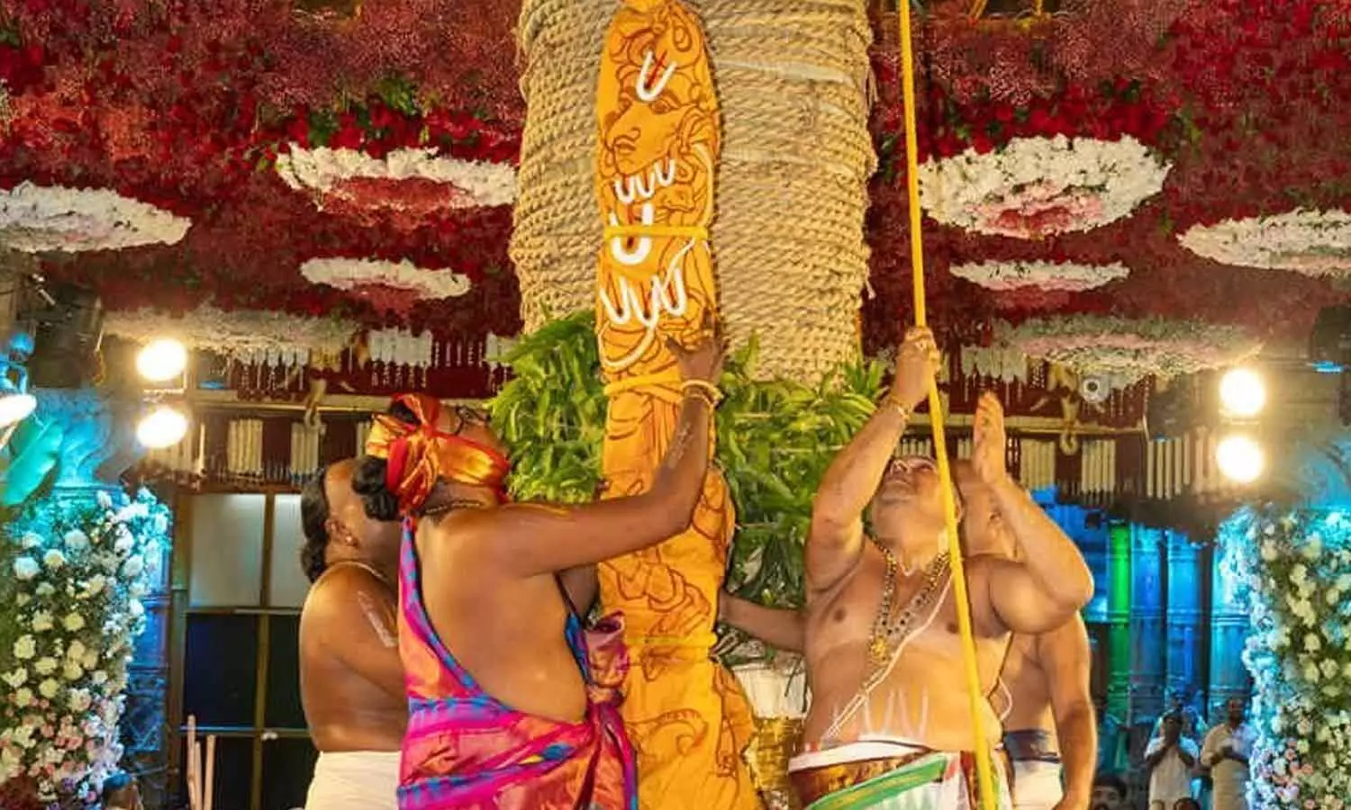 Priests and officials participating in the traditional Dhwajarohanam ceremony as the Garuda flag is hoisted atop the temple mast in Tirumala on Tuesday Priests and officials participating in the traditional Dhwajarohanam ceremony as the Garuda flag is hoisted atop the temple mast in Tirumala on Tuesday