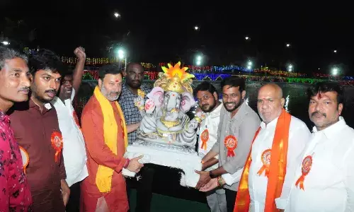 TTD Board member Bhanu Prakash Reddy along with others immersing a Ganesh idol in Vinayaka Sagar in Tirupati on Wednesday