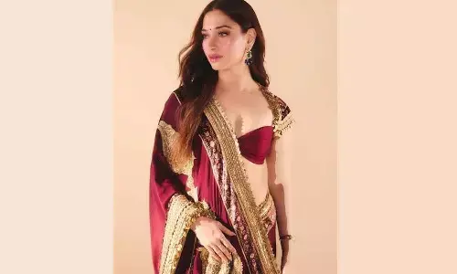 Tamannaah turns heads in royal maroon saree